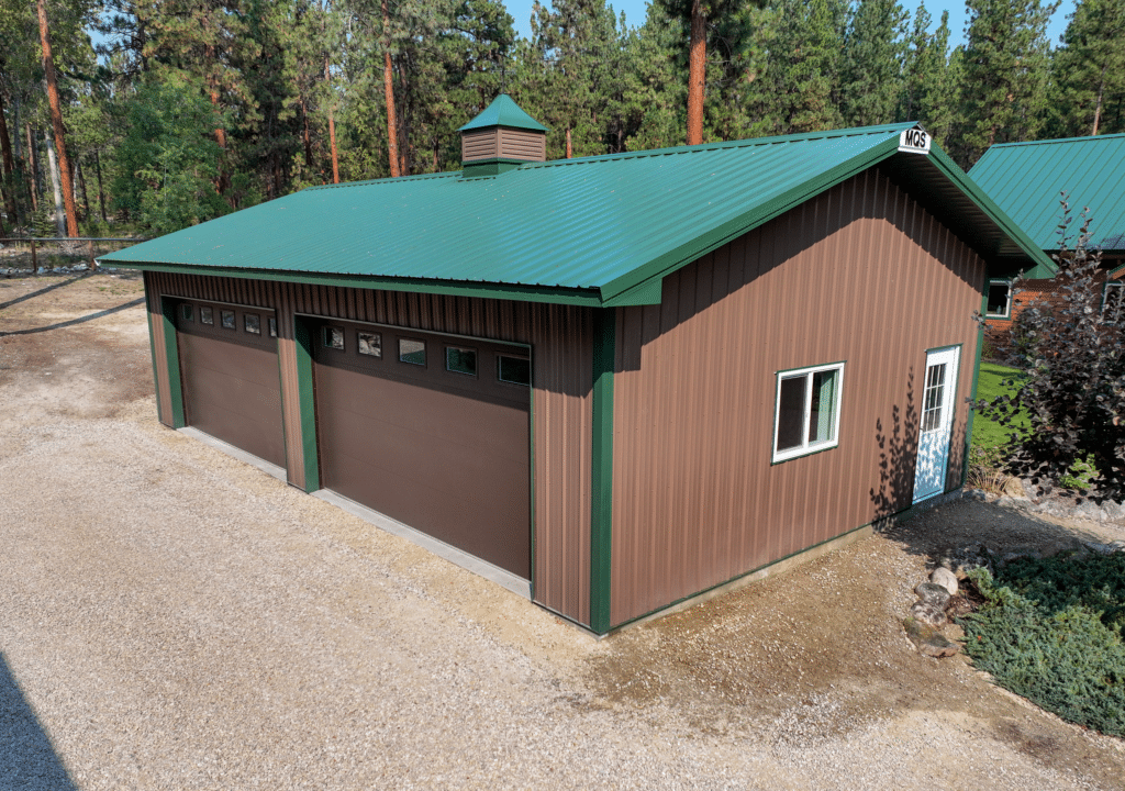 A 24x40x10 2-Door, Home Garage, Built by MQS, featuring Brown Metal Siding, Evergreen Metal Trim, and Evergreen Metal Roofing in Victor, Montana A 24x40x10 2-Door, Home Garage, Built by MQS, featuring Brown Metal Siding, Evergreen Metal Trim, and Evergreen Metal Roofing in Victor, Montana