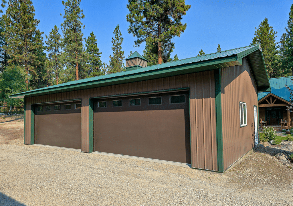 A 24x40x10 2-Door Home Garage, Built by MQS, featuring Brown Metal Siding, Green Metal Trim and Green Metal Roofing in Victor, MT A 24x40x10 2-Door Home Garage, Built by MQS, featuring Brown Metal Siding, Green Metal Trim and Green Metal Roofing in Victor, MT