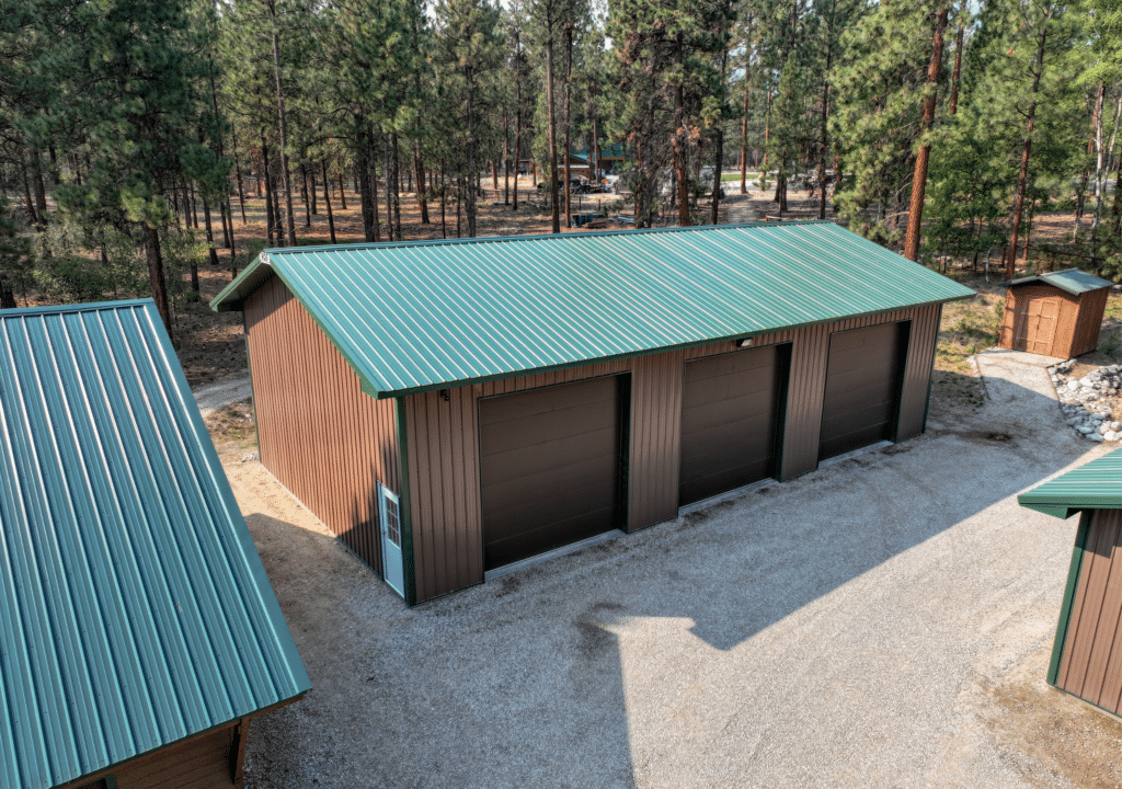 A 30x56x14 Equipment Shop_Vehicle Storage, built by MQS, Featuring Brown Metal Siding, with Green Metal Trim and Roofing, in Victor, Montana A 30x56x14 Equipment Shop_Vehicle Storage, built by MQS, Featuring Brown Metal Siding, with Green Metal Trim and Roofing, in Victor, Montana