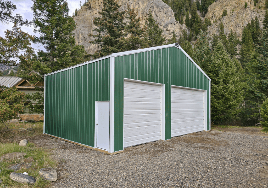 A 32x24x12 Commercial Vehicle_Equipment Storage, Built By MQS, Featuring Evergreen Metal Siding, And White Metal Trim and Roofing, In Gallatin Gateway, MT A 32x24x12 Commercial Vehicle_Equipment Storage, Built By MQS, Featuring Evergreen Metal Siding, And White Metal Trim and Roofing, In Gallatin Gateway, MT
