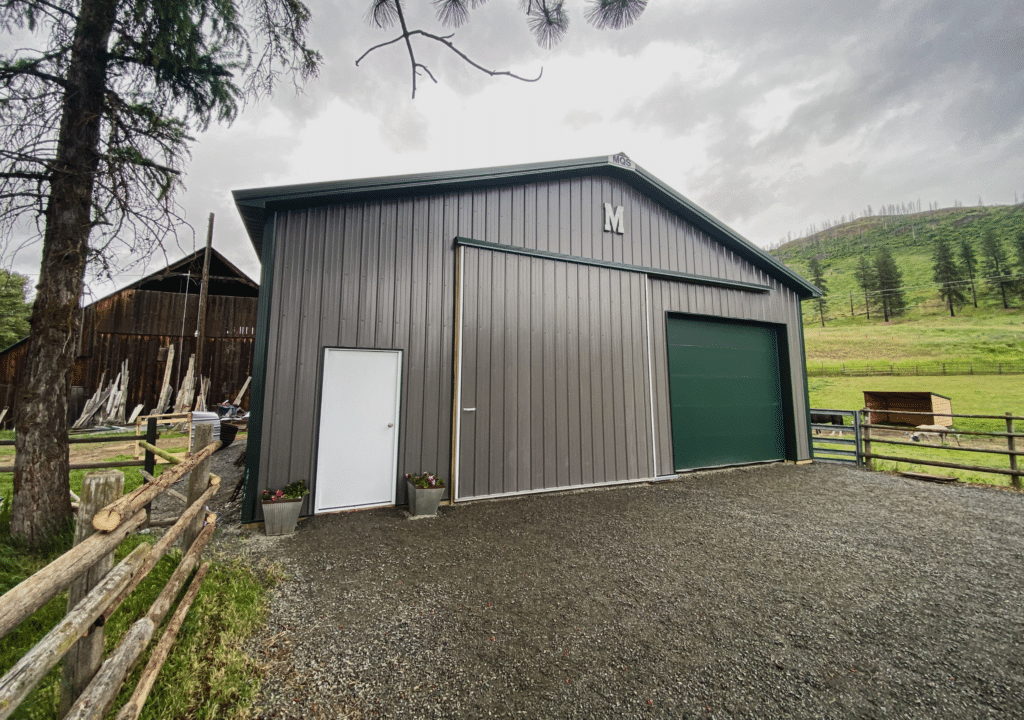 A 36x40x12 AG Equipment Storage, Built by MQs, featuring Gray Metal Siding, And Forest Green Metal Trim and Roofing, With sidelights, in Colville, WA A 36x40x12 AG Equipment Storage, Built by MQs, featuring Gray Metal Siding, And Forest Green Metal Trim and Roofing, With sidelights, in Colville, WA