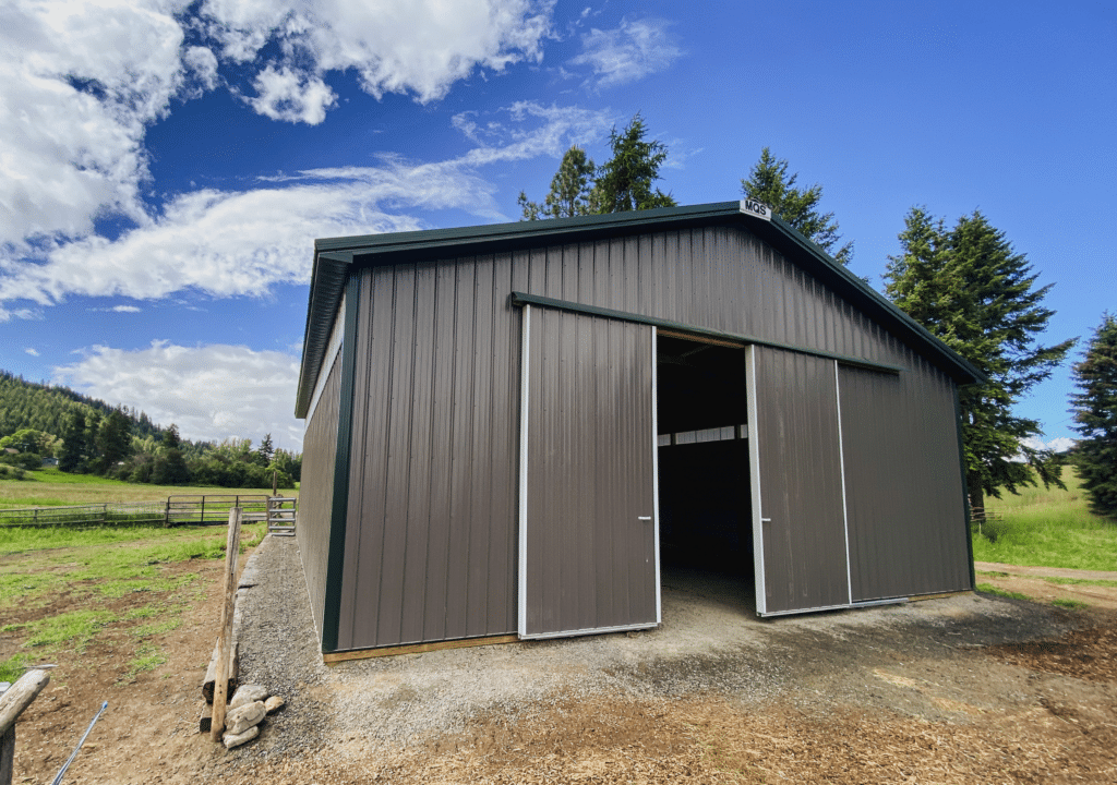 A 36x40x12 AG Equipment Storage with sidelights, Built by MQs, featuring Gray Metal Siding, And Forest Green Metal Roofing, in Colville, WA A 36x40x12 AG Equipment Storage with sidelights, Built by MQs, featuring Gray Metal Siding, And Forest Green Metal Roofing, in Colville, WA
