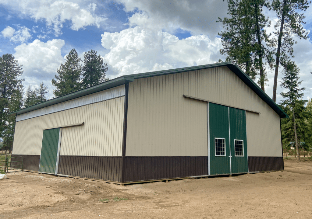 A 60x60x16 Indoor Riding Arena, built by MQS, featuring Tan Metal Siding, Evergreen Metal Trim and Roofing, in Newport, WA A 60x60x16 Indoor Riding Arena, built by MQS, featuring Tan Metal Siding, Evergreen Metal Trim and Roofing, in Newport, WA