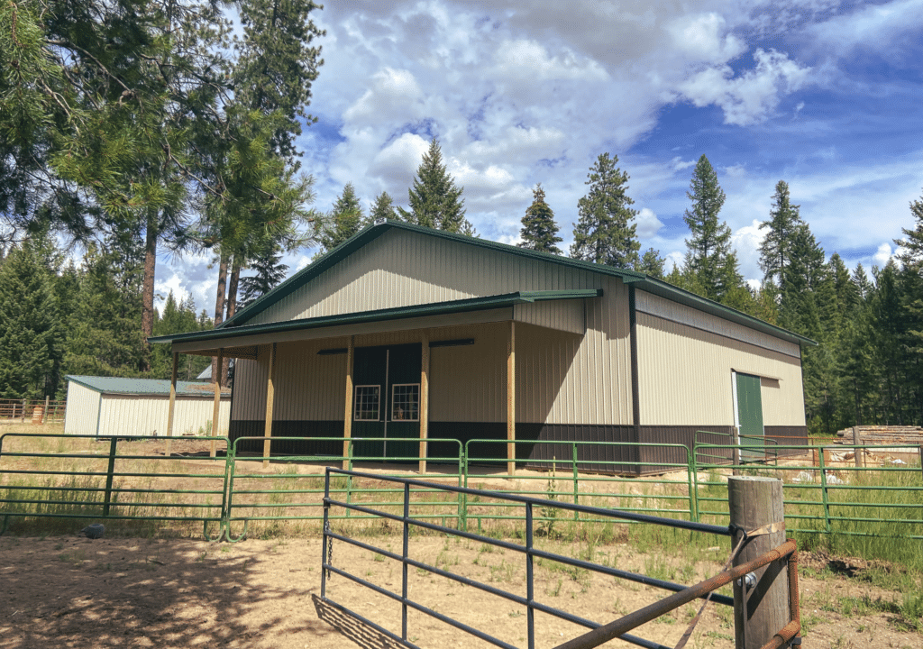 A 60x60x16 Indoor Riding Arena with sidelight, built by MQS, featuring Tan Metal Siding, Evergreen Metal Trim and Roofing, in Newport, Washington A 60x60x16 Indoor Riding Arena with sidelight, built by MQS, featuring Tan Metal Siding, Evergreen Metal Trim and Roofing, in Newport, Washington