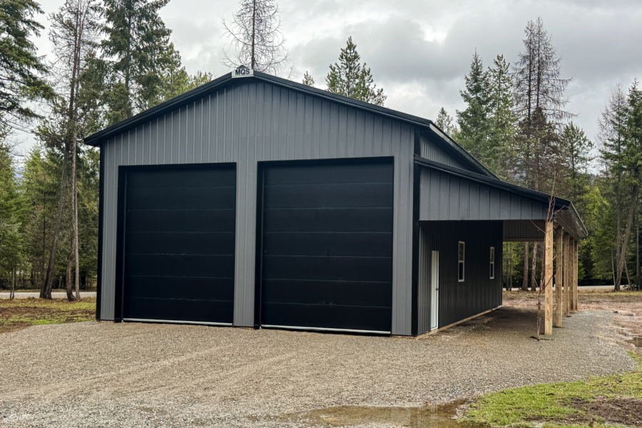 A 30x48x16 Hobby-Workshop and Home Garage, built by MQS, featuring dark grey metal siding and black metal roofing, available for custom build in Montana