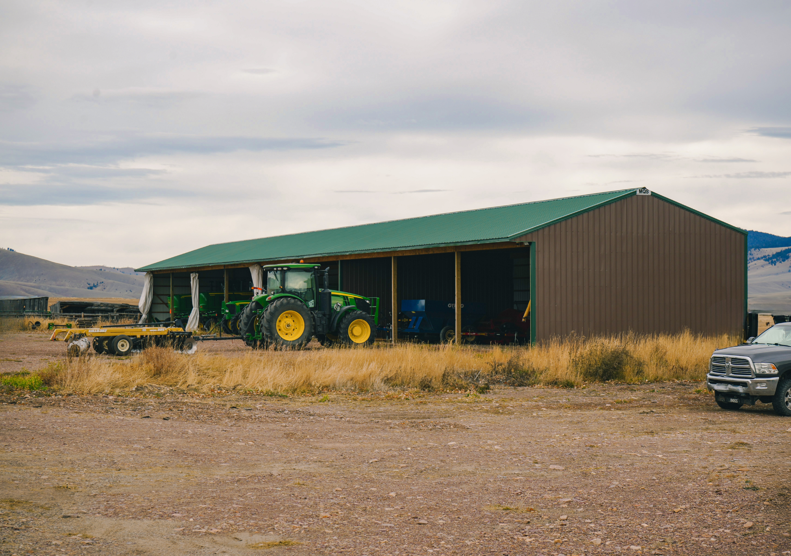 What Are the Benefits of Choosing Post Frame Construction Over Steel Building Construction for Heavy Machinery and Equipment Storage?