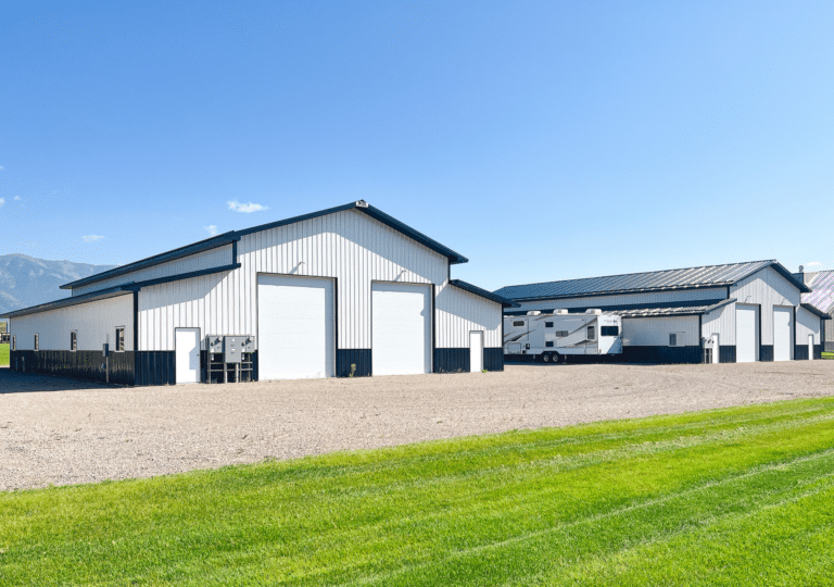 36x88x18 Commercial pole barn with 2 enclosed lean-tos for offices and storage spaces, Featuring White Metal Siding, With Black Metal Trim and Roofing, available for custom build by MQS in Yellowstone County
