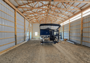 A 30x48x16 Vehicle_RV Multi-purpose storage residential pole barn Interior, Built By MQS, featuring Dark Grey metal Siding, And Copper Penny Metal Trim, in Florence, MT