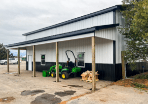 A 32x44x16 Hobby Shop_Workshop Storage Garage Residential Pole Building, Featuring white metal siding, and black metal roofing, Built by MQS in Columbia Falls, MT