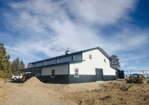 A 36x60x16 Hobby Workshop Home Garage, Built By MQS, Featuring White Metal Siding, Black Metal Wainscoting, and Black Metal Roofing, in Billings, MT A 36x60x16 Hobby Workshop Home Garage, Built By MQS, Featuring White Metal Siding, Black Metal Wainscoting, and Black Metal Roofing, in Billings, MT