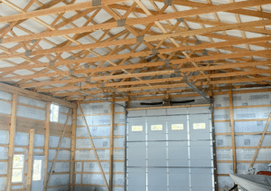 A 36x60x16 Hobby Workshop Home Garage Interior, Built By MQS, Featuring White Metal Siding, and Black Metal Trim and Roofing, in Billings, MT