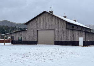 A 40x100x20 Multi-Stall Monitor Style Horse_Equine Equestrian Pole Barn, featuring Distressed Gray Barnwood Metal Siding, and Krinkle Burnished slate Trim and Roofing, Built By MQS,in Elliston, MT