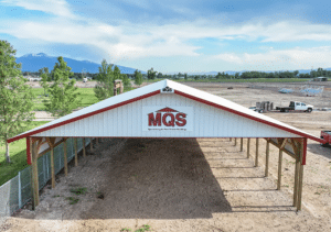 A 44x90x12 Commercial Ag Horse Shelter Pole Building, Built by MQS, featuring white metal siding, and white metal roofing, with rural red metal trim, in Hamilton, MT