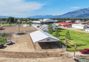 A 44x90x12 Commercial Ag Horse Shelter Pole Building, featuring white metal siding, and white metal roofing, with rural red metal trim, Built By MQS, in Hamilton, MT