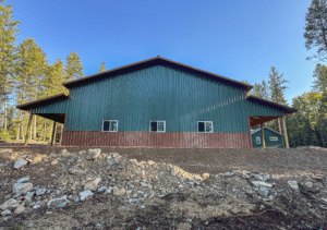 A 50x40x16 Fully Insulated Garage_Hobby Shop, Built By MQS, Featuring Evergreen Metal Siting, and Aged Copper Metal roofing and wainscoting, in Huson, MT
