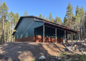 A 50x40x16 Fully Insulated Garage_Hobby Shop, Built By MQS, Featuring Evergreen Metal Siting, and Aged Copper Metal roofing, in Huson, MT