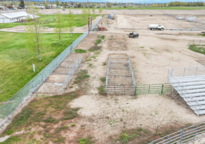 Before of A 44x90x12 Commercial Ag Horse Shelter Pole Building, Built by MQS, featuring white metal siding, with rural red metal trim, in Hamilton, MT