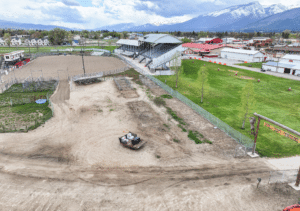 Before of A 44x90x12 Commercial Ag Horse Shelter Pole Building, featuring white metal siding, and white metal roofing, with rural red metal trim, Built By MQS, in Hamilton, MT