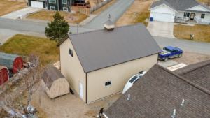 A 26x36x14 Hobby Shop_Workshop_Garage, built by MQS, featuring Ivory Metal Siding, and Burnished Slate Metal Roofing, In Helena, MT