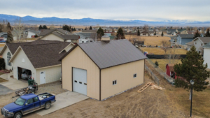 A 26x36x14 Residential hobby shop, featuring Ivory Metal Siding, and Burnished Slate Metal Trim and Roofing, Built By MQS, In Helena, MT