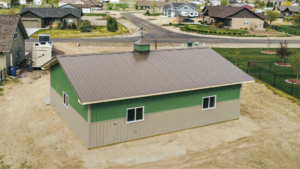 A 30x40x10 Hobby_workshop_home garage, built by MQS, featuring Medium green metal siding, and weathered copper metal roofing, in Helena, MT