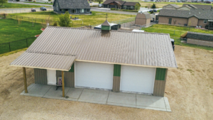 A 30x40x10 Hobby_workshop_home garage, featuring Medium green metal siding, and weathered copper metal roofing, built by MQS, in Helena, MT