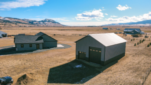 A 30x48x16 Hobby_Workshop_ Home Garage, Built By MQS, Featuring Charcoal Metal Siding, Black Metal Trim, and Taupe Metal Roofing, in Helena, MT