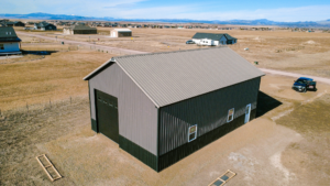 A 30x48x16 Hobby_Workshop_ Home Garage, Built By MQS, Featuring Charcoal Metal Siding, and Taupe Metal Roofing, in Helena, MT