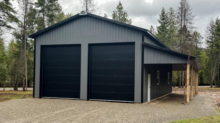 A 30x48x16 Hobby_Workshop_Home Garage, featuring dark grey metal siding and black metal roofing, available for custom build by MQS in Lockwood, MT
