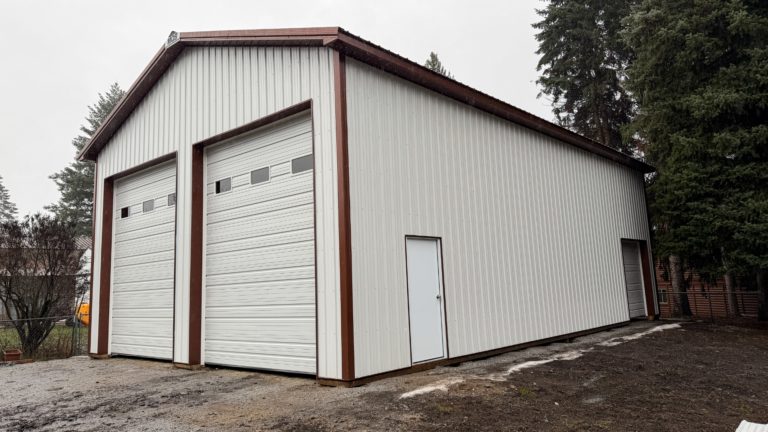 A 30x48x16 Vehicle_RV Storage, featuring white metal siding, and aged copper metal trim and roof, available for custom build by MQS in Lewis and Clark County, MT