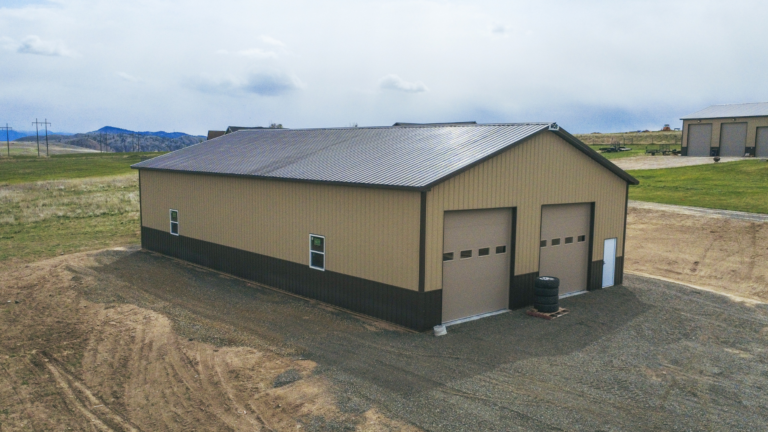 A 40x72x14 Hobby_Workshop_Home Garage, Built by MQS, featuring beige metal siding, and burnished slate metal roofing and trim, in Helena, MT