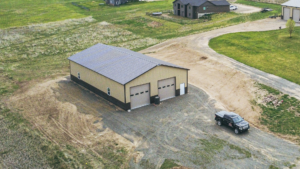 A 40x72x14 Hobby_Workshop_Home Garage, Built by MQS, featuring beige metal siding, and burnished slate metal roofing, in Helena, MT