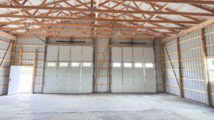 A 40x72x14 Hobby_Workshop_Home Garage Interior, Built by MQS, featuring beige metal siding, and burnished slate metal roofing and trim, in Helena, MT