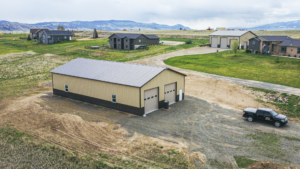 A 40x72x14 Hobby_Workshop_Home Garage, featuring beige metal siding, and burnished slate metal roofing and trim, Built by MQS, in Helena, MT