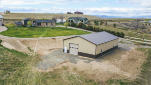 A 40x72x14 Hobby_Workshop_Home Garage, featuring beige metal siding, and burnished slate metal roofing, built by MQS, in Helena, MT