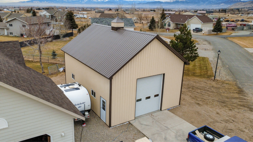A 26x36x14 Residential hobby shop, featuring Ivory Metal Siding, and Burnished Slate Metal Roofing, available for custom build by MQS, with permit assistance in MT
