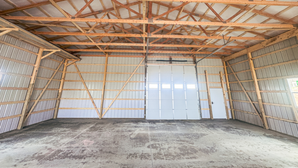 A 40x72x14 Hobby_Workshop_Home Garage Interior, with beige metal siding, and burnished slate metal roofing and proper engineering, available for custom build from MQS in MT