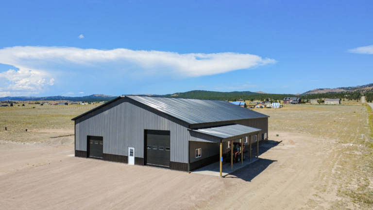 A 60x100x16 Barndominium Shell and Shop, featuring Dark Grey Metal Siding, And Black metal Trim and Roofing, Built by MQS, in Helena, MT