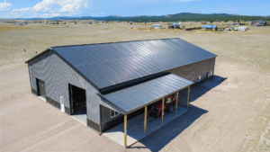 A 60x100x16 Barndominium Shell_Shop, featuring Dark Grey Metal Siding, And Black metal Roofing, Built by MQS in Helena, MT