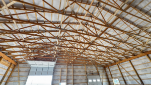 A 60x100x16 Barndominium Shell_Shop interior, featuring Dark Grey Metal Siding, And Black metal Trim and Roofing, Built by MQS, in Helena, MT