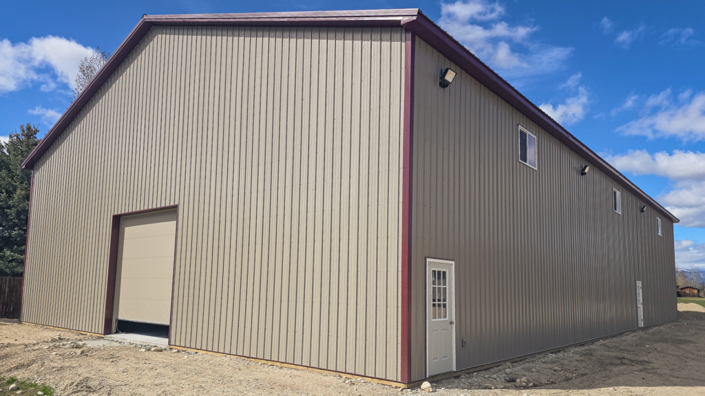 A 60x100x20 Commercial Storage Pole Building, with Taupe Metal Siding, and Berry Metal Trim, along will all needed enginerring plans, available for custom order by MQS in Montana