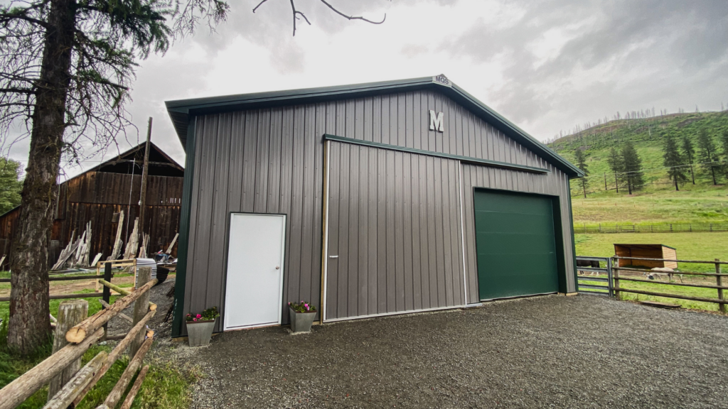 A custom 36x40x12 AG Equipment Storage, featuring Gray Metal Siding, And Forest Green Metal Trim and Roofing, With sidelights, rated to 90mph winds and available for custom build by MQS in MT