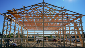 An in process 40x64x16 Bardominium_Garage, Featuring Gray Metal Siding, Brown Metal Trim, and Black Metal Roofing, Built By MQS in Stevensville, MT