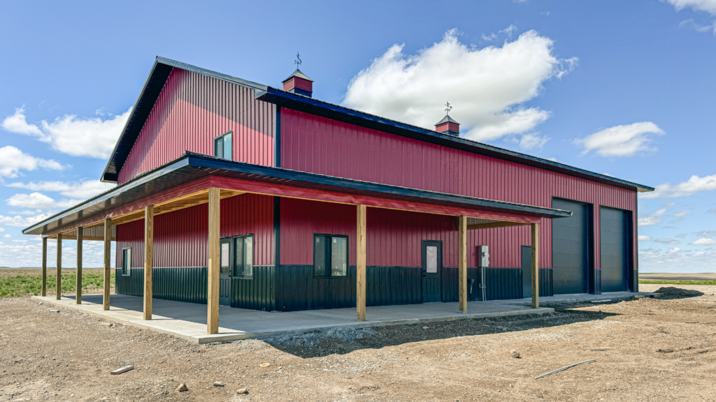How to financially compare a home against a 48x72x18 Barndominium Shell shouse with covered patio, Built by MQS, featuring Rural Red metal siding, and Black metal roofing and trim, in MT