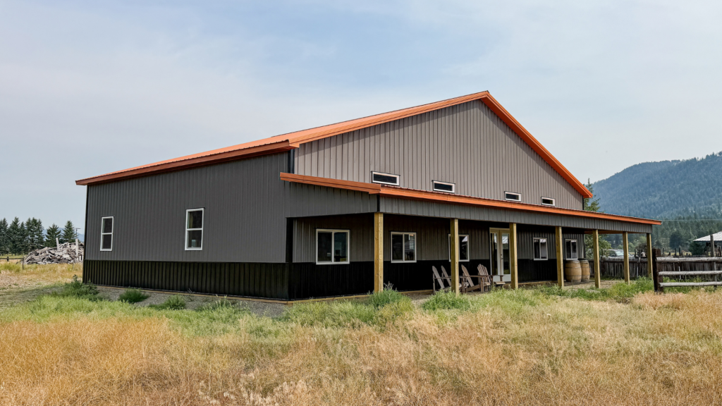 How to financially compare a home against a 60x40x12 Barndominium Shell, Built by MQS, featuring Charcoal metal siding, with black metal trim, and copper penny metal roofing, in MT