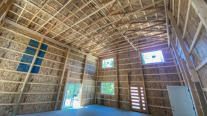 Interior of a 28x32x18 Barndominium Shell attached to 24x32x10 Pole barn Garage, featuring Dark Grey Metal Siding and Roofing, built by MQS in Bayview, ID