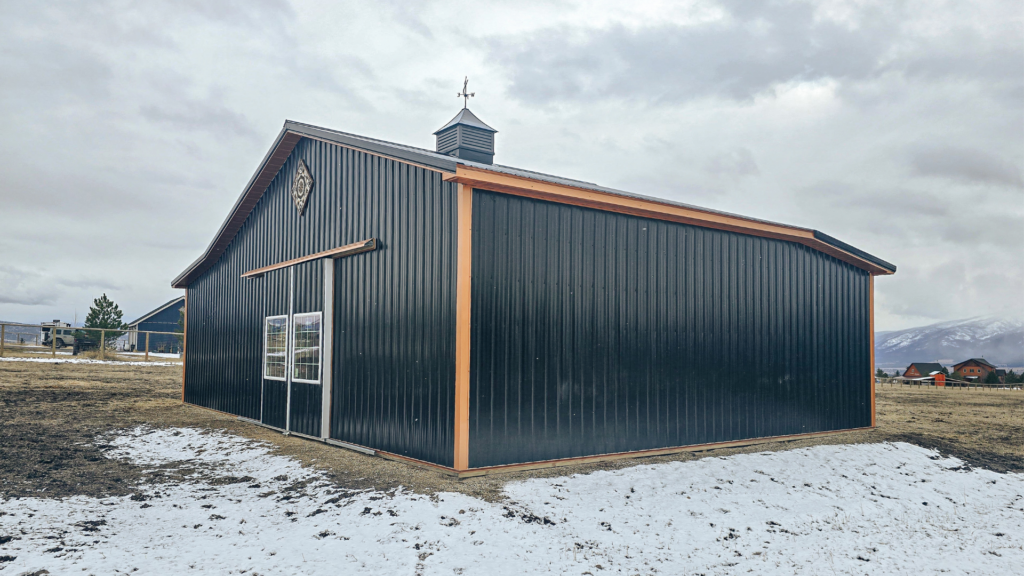 a 36x24x12 2 stall Horse Barn With Hay Storage Interior and all needed engineering, featuring Black metal siding and roofing, and Copper Penny Metal Trim, available for custom order from MQS in MT